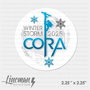 May include: A white round sticker with a blue and white graphic of a lineman climbing a utility pole. The text "Winter Storm 2025 Cora" is in blue and white. The sticker has a white background with a gray and white swirl pattern. The text "Lineman Outfitters" is in black and white with a lightning bolt. The text "2.25" x 2.25" is in black.