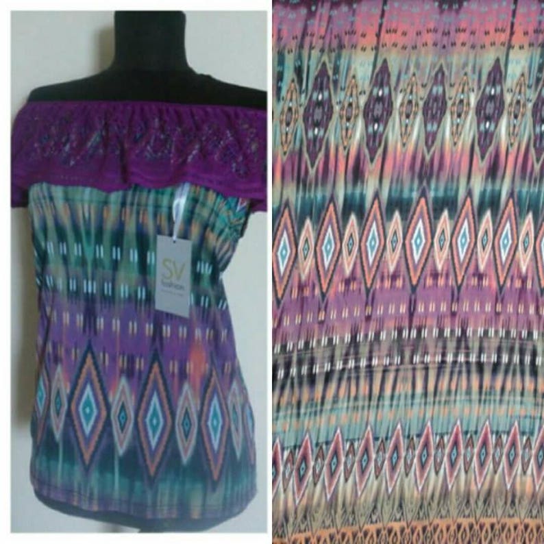 May include: Off-the-shoulder top with a purple lace trim and a colorful geometric print. The print features a pattern of diamonds and stripes in shades of blue, green, purple, and orange. The top has a tag that says "SV Fashion".