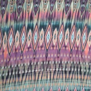 May include: A colorful fabric with a repeating geometric pattern of diamonds in shades of pink, orange, blue, and green. The fabric has a subtle tie-dye effect.