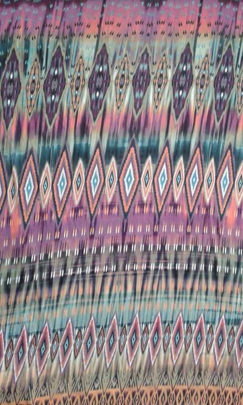 May include: A colorful fabric with a repeating geometric pattern of diamonds in shades of pink, orange, blue, and green. The fabric has a subtle tie-dye effect.
