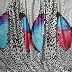 May include: White fabric with a repeating pattern of colorful butterfly silhouettes on a black and white leopard print background.