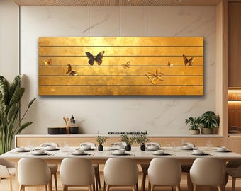 May include: A golden wall art piece with a wooden plank design. Several butterfly silhouettes in various sizes and shades of brown are scattered across the surface. The artwork is mounted above a dining table, creating a nature-inspired theme.