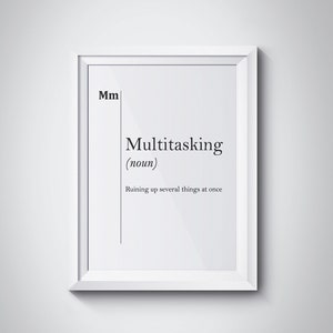 May include: A white framed print with the word "Multitasking" defined as "Ruining up several things at once".