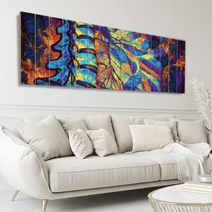 May include: A multi-panel wall art piece featuring a vibrant, abstract depiction of a human spine and branching nerve structures. The artwork uses a bold color palette of deep blues, bright yellows, fiery oranges, and purples in a fluid style.