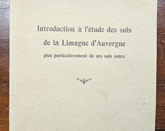 May include: A vintage book cover with the title "Introduction à l'étude des sols de la Limagne d'Auvergne" by Pierre Delaunay. The cover is a light beige color with black text and a decorative emblem. Published in 1936.