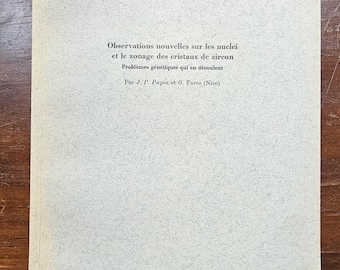 May include: A vintage scientific paper with the title "Observations nouvelles sur les nuclei et le zonage des cristaux de zircon" in French. The paper is light gray with a textured surface and black text. The paper is from 1970.