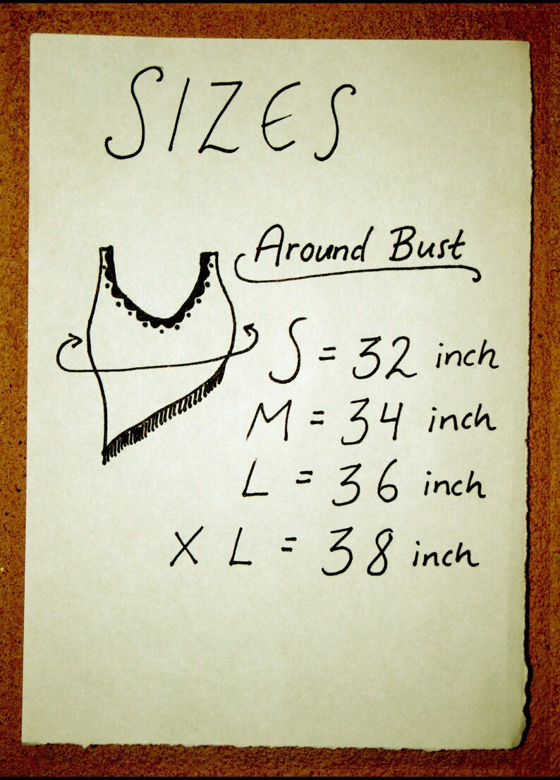 May include: A handwritten chart showing sizes for a garment, with a simple drawing of a tank top. The chart lists sizes S, M, L, and XL with corresponding bust measurements in inches: 32, 34, 36, and 38 inches.