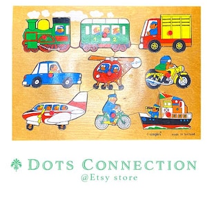 May include: Wooden puzzle featuring colorful illustrations of various vehicles, including a train, car, helicopter, motorcycle, airplane, bicycle, truck, and boat. The puzzle pieces are designed with a simple, cartoonish style, perfect for young children.