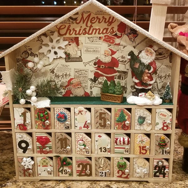 Custom made by hand. Wooden house advent calendar. Doors open to put a surprise of your choice inside. Approximately 14 inches tall at peak.