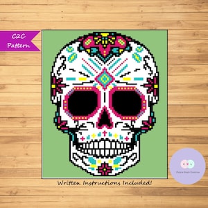 May include: A colorful pixelated sugar skull design in a C2C crochet pattern. Written instructions are included.