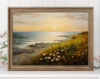 Könnte beinhalten: Ein gerahmtes Gemälde, das eine Meereslandschaft mit einer felsigen Küste und einem Feld voller Wildblumen im Vordergrund zeigt. Die Sonne geht über dem Meer unter und taucht die Szene in ein warmes Licht.