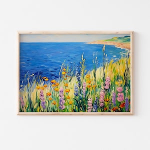 Pode incluir: Uma pintura de uma paisagem marítima com um oceano azul e um penhasco verde gramado com flores silvestres coloridas em primeiro plano.