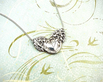 Silverware heart pendant