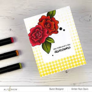 May include: A greeting card with a yellow polka dot background and a red and green floral design. The card has the text "You make every day awesome" written on it.