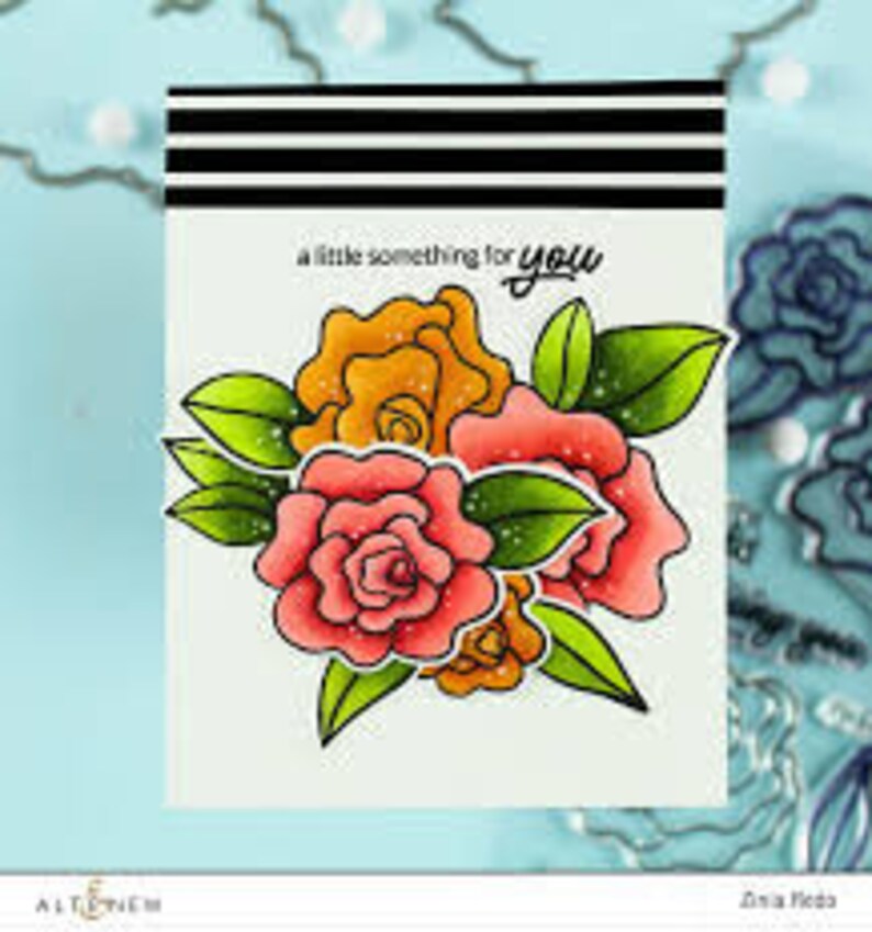 May include: A greeting card with a bouquet of pink and orange roses with green leaves and the text "a little something for you".