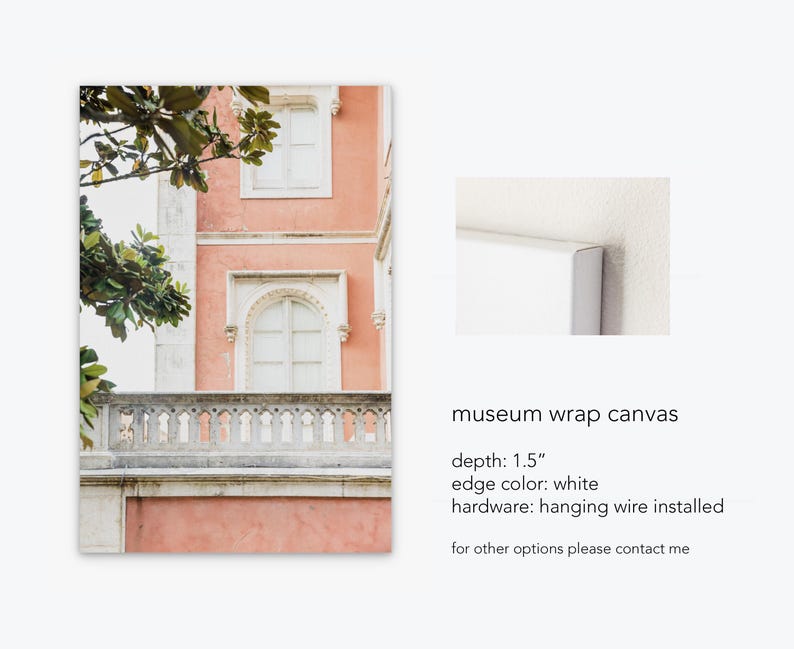 A mockup of a canvas print depicting a pink building with white windows and a stone balcony. The building is surrounded by green trees. the text reads: museum wrap canvas, depth: 1.5”, edge color: white, hardware: hanging wire installed, for other options please contact me.”