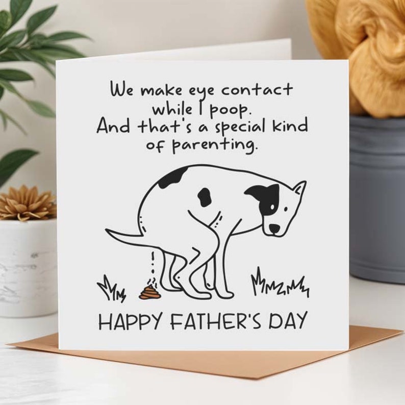 May include: A white card with black text and a black and white cartoon dog pooping. The text reads "We make eye contact while I poop. And that's a special kind of parenting." and "Happy Father's Day".
