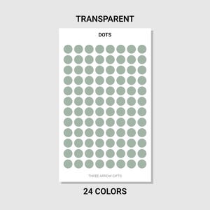 May include: A white rectangular sticker sheet with rows of sage green dot stickers. The text "TRANSPARENT" is at the top, "DOTS" in the middle, and "THREE ARROW GIFTS" and "24 COLORS" at the bottom.