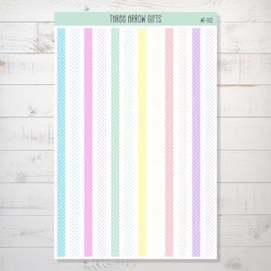 May include: A sheet of colourful washi tape with white polka dots. The tape is arranged in vertical stripes of light blue, pink, light green, yellow, light pink, and purple.