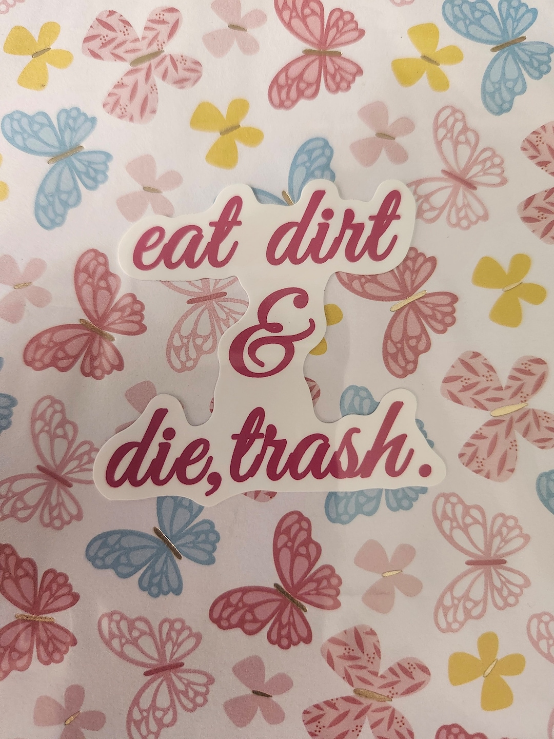 Eat Dirt and Die Trash Sticker with a bold, rebellious design