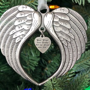May include: Silver angel wing ornament with a heart-shaped charm that reads "Your Wings were Ready but my Heart was Not".