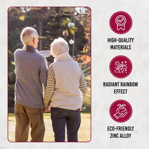 May include: An elderly couple stands outdoors, admiring hanging crystal ornaments. The image includes text that reads "HIGH-QUALITY MATERIALS", "RADIANT RAINBOW EFFECT", and "ECO-FRIENDLY ZINC ALLOY". The scene is set in a natural, sunlit environment.