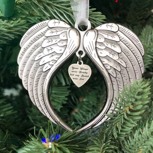 May include: Silver angel wing ornament with a heart-shaped charm that reads "Your Wings were Ready but my Heart was Not".