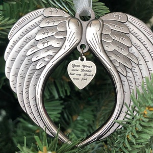 May include: Silver angel wings ornament with a heart-shaped charm that reads "Your Wings were Ready but my Heart was Not".
