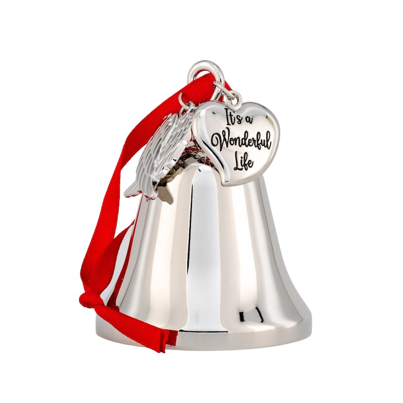 May include: A silver bell ornament with a red ribbon. The bell has a heart-shaped charm that reads "It's a Wonderful Life." A small silver wing charm is also attached. This holiday decoration is perfect for Christmas.