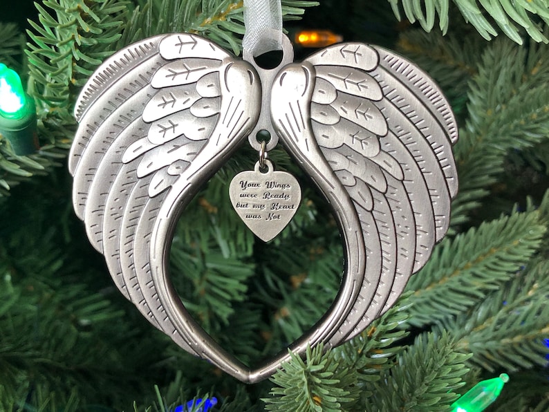 May include: Silver angel wing ornament with a heart-shaped charm that reads "Your Wings were Ready but my Heart was Not".