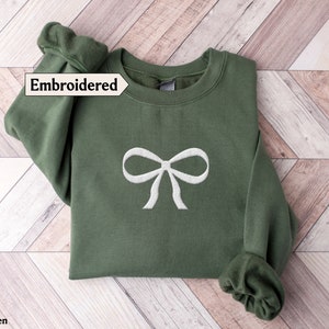 Brianna Lace Bow Embroidered Exposed Seam Sweatshirt