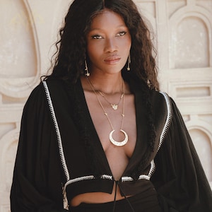 Bohemian Elegance: Our Hand Embroidered Top is a testament to artistry and love. Adorned with intricate details, it's a unique addition to your wardrobe