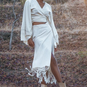 Personalize your wardrobe with this fashionable Off-White Goddess Tassels Skirt & raw sustainable cotton fabric.