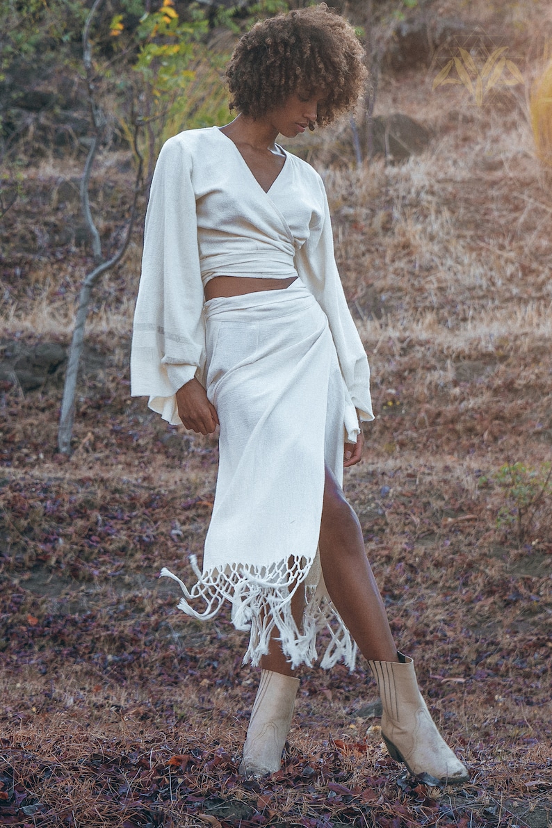 Personalize your wardrobe with this fashionable Off-White Goddess Tassels Skirt & raw sustainable cotton fabric.