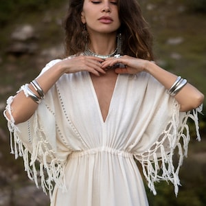 bali layered dress Romantic and effortlessly chic  This off-shoulder boho dress features  delicate prints and flowing layers that move beautifully with every step.  Perfect for relaxed afternoons, golden sunsets, and dreamy getaway moments 