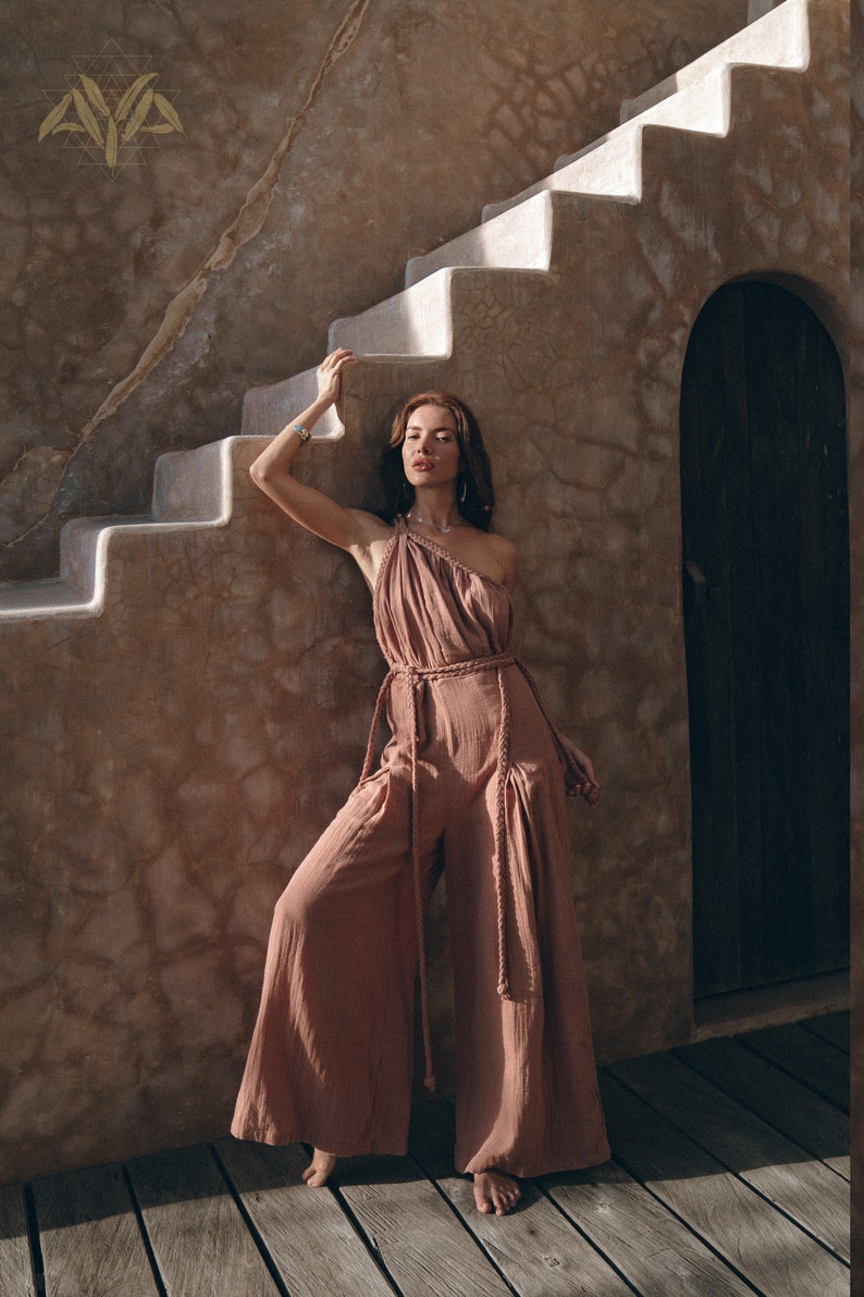 Take Your Look to the Next Level with Our Uniquely Handcrafted Cold Shoulder Jumpsuit. Our Dusty Pink Romper for Women Makes Perfect Sense in Your Closet.