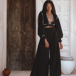 Artistry in Motion: Celebrate craftsmanship with our Flowing Elegant Jacket. Hand embroidery by local artisans creates a masterpiece of bohemian elegance