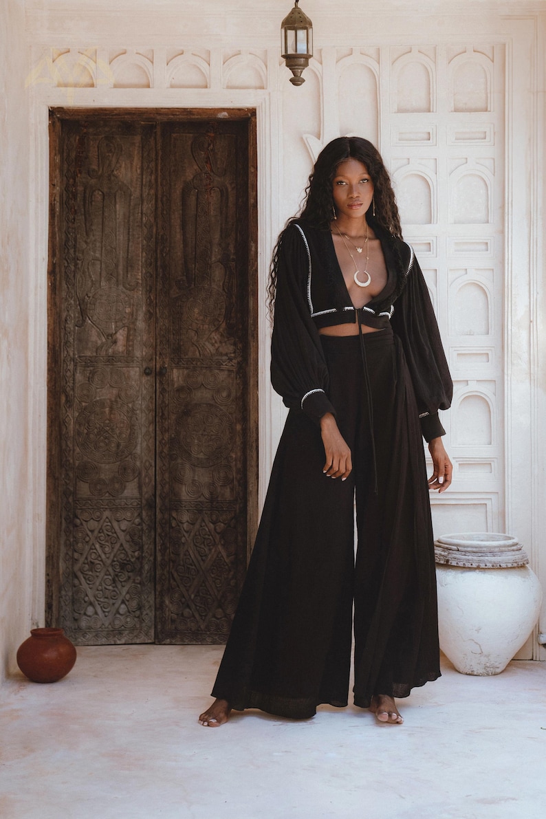 Artistry in Motion: Celebrate craftsmanship with our Flowing Elegant Jacket. Hand embroidery by local artisans creates a masterpiece of bohemian elegance