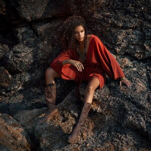 Elevate Your Style with Our Red Wide Leg Mini Jumpsuit!