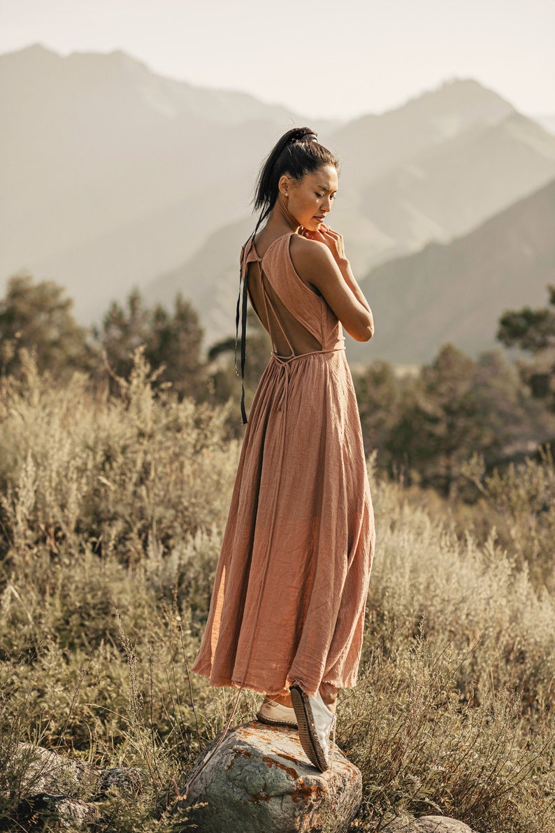 Add a beautiful accent to your bohemian wedding with our dusty pink bridesmaid dress. Crafted with pure organic raw cotton and with open back and laced waist, it's perfect for any special occasion!