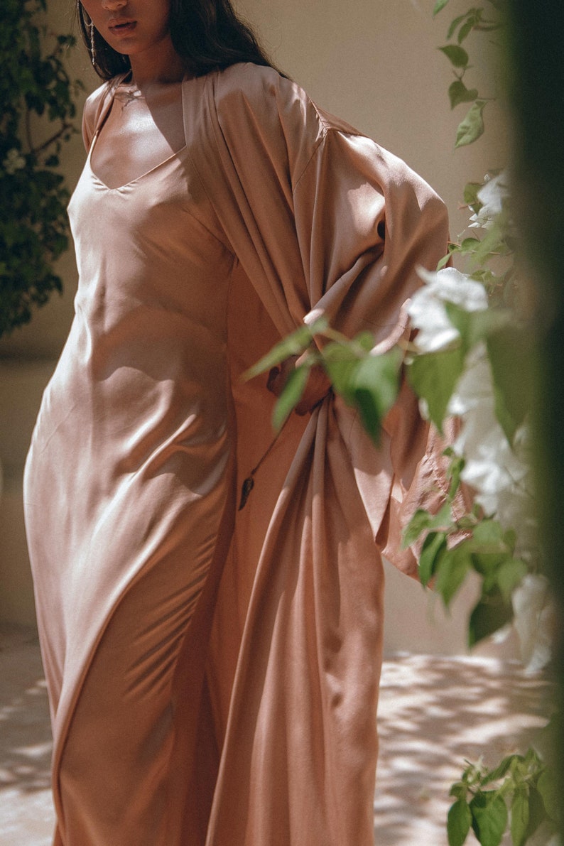 Turn heads at any event in this stunning Rose Dress. Expertly made from organic Ahimsa Silk with botanically dyed fabric, show off your elegance.