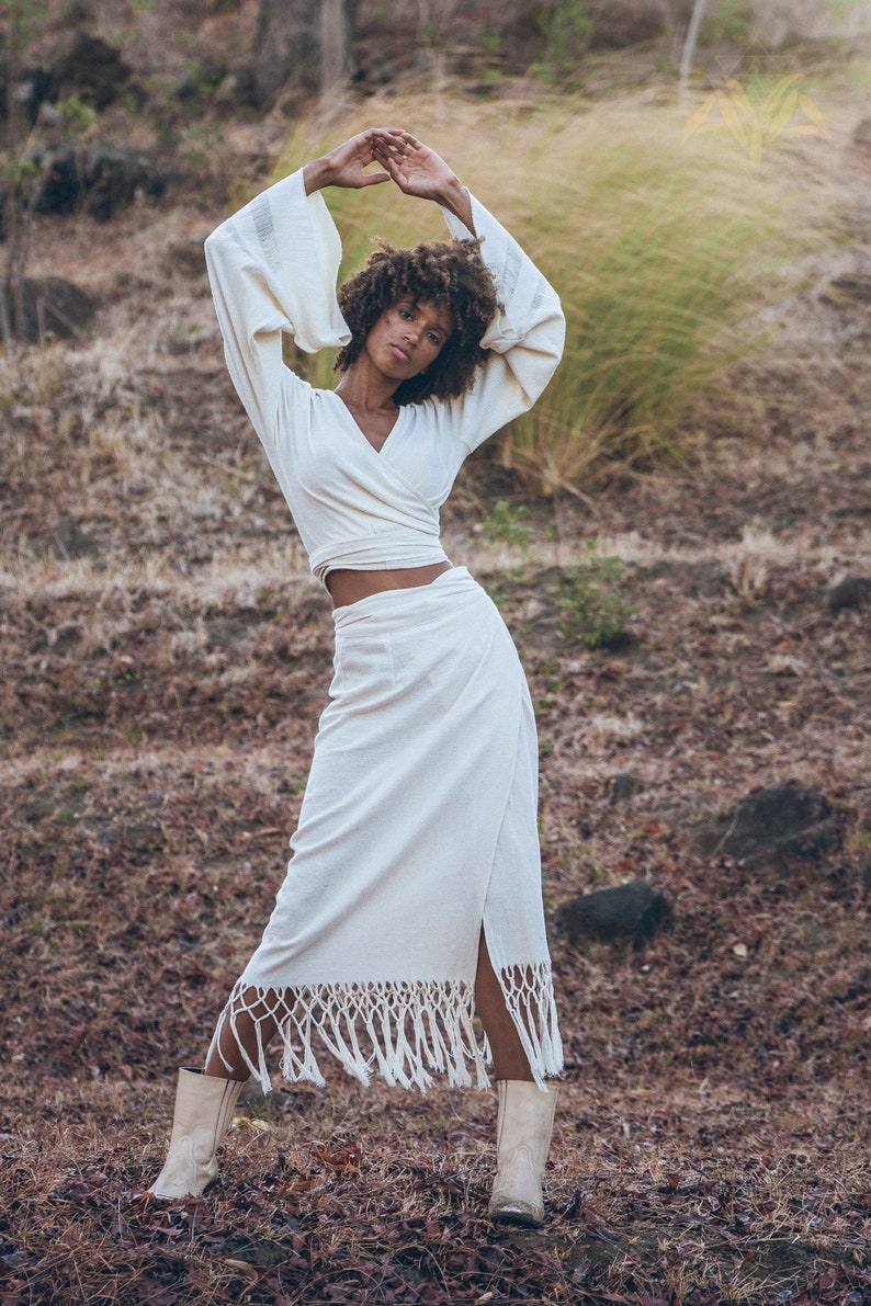 Capture the trend of Tribal Womens Clothing with this handcrafted Off-White Goddess Tassels Skirt.