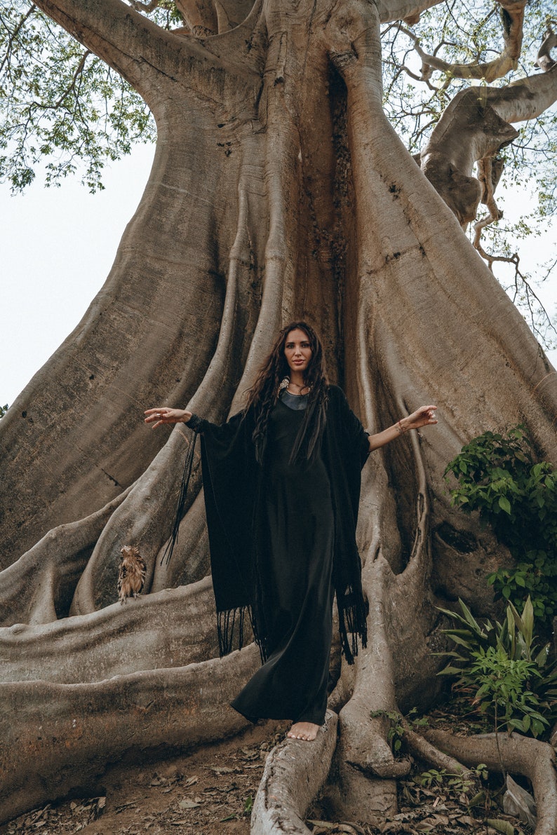 Feel like royalty in our Ceremony Cover up featuring a full coverage design and knitted detailing.