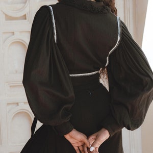 Versatile Organic Charm: Embrace the flowy and elegant feeling of our Bohemian Organic Blouse. Perfect for pairing with jeans, skirts, or even as a beach cover-up.