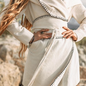High Long Jacket with Belt Hood - Keep it on trend with this delicately designed and gracefully fitted high long jacket complete with belt hood.