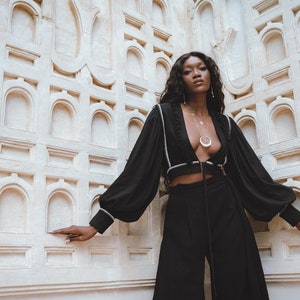 Bohemian Dream: Immerse yourself in the charm of our Puff Sleeves Top. The exquisite hand embroidery showcases intention and love in every stitch