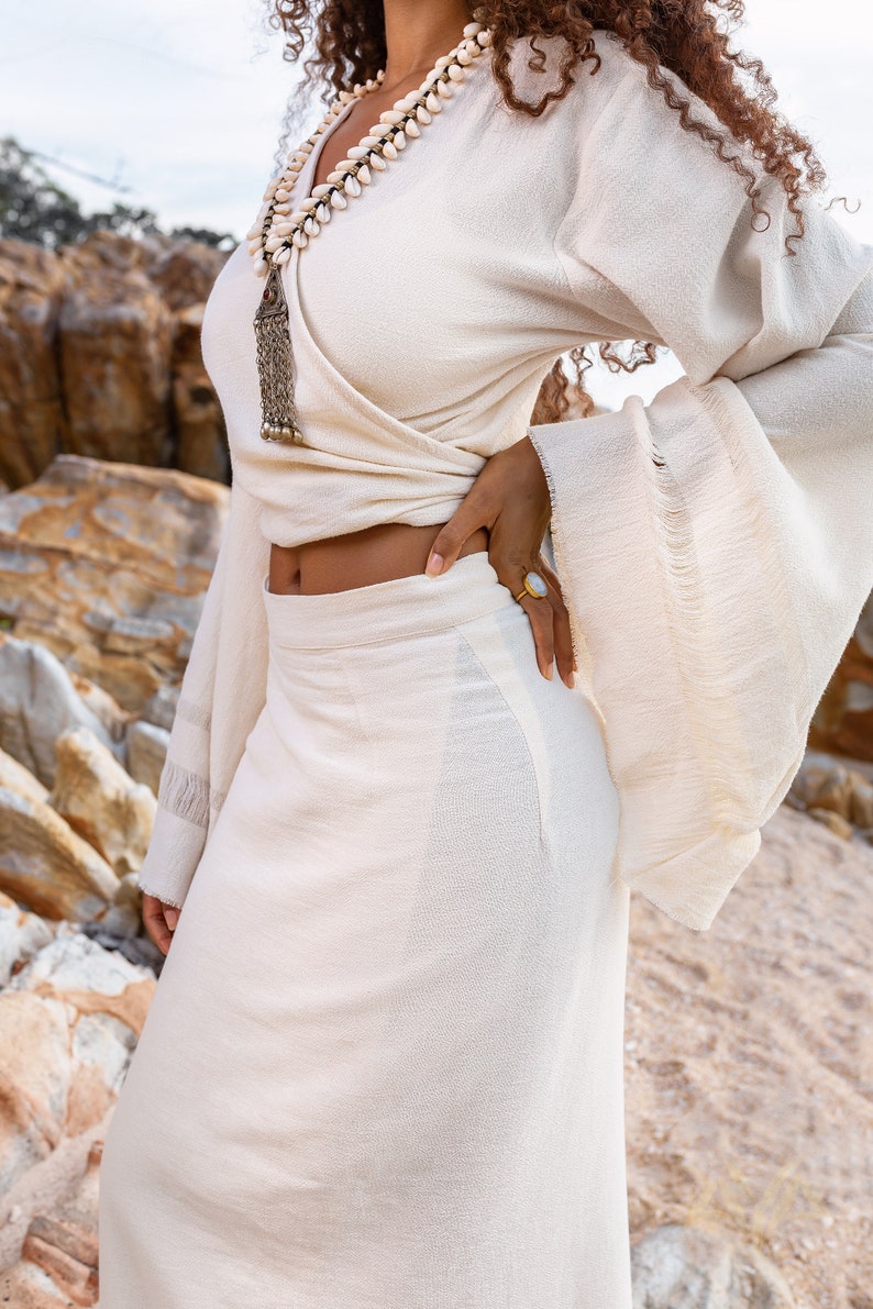 Spoil yourself with the Off-White Goddess Tassels Skirt for the ultimate minimalist look.