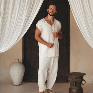 Chill out in style with this men's handmade Boho shirt featuring intricate knotwork. This off-white T-shirt will channel your inner effortless cool and you can customize your fit with sizes from S–XL.