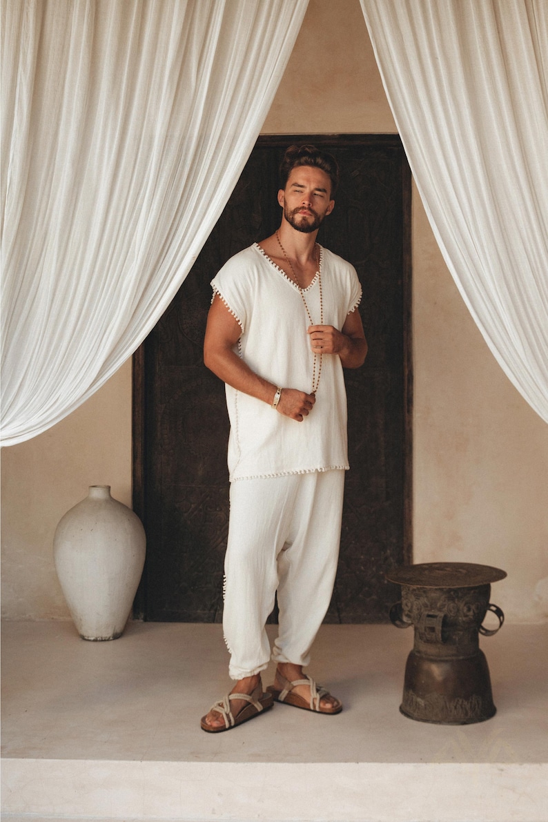 Chill out in style with this men's handmade Boho shirt featuring intricate knotwork. This off-white T-shirt will channel your inner effortless cool and you can customize your fit with sizes from S–XL.