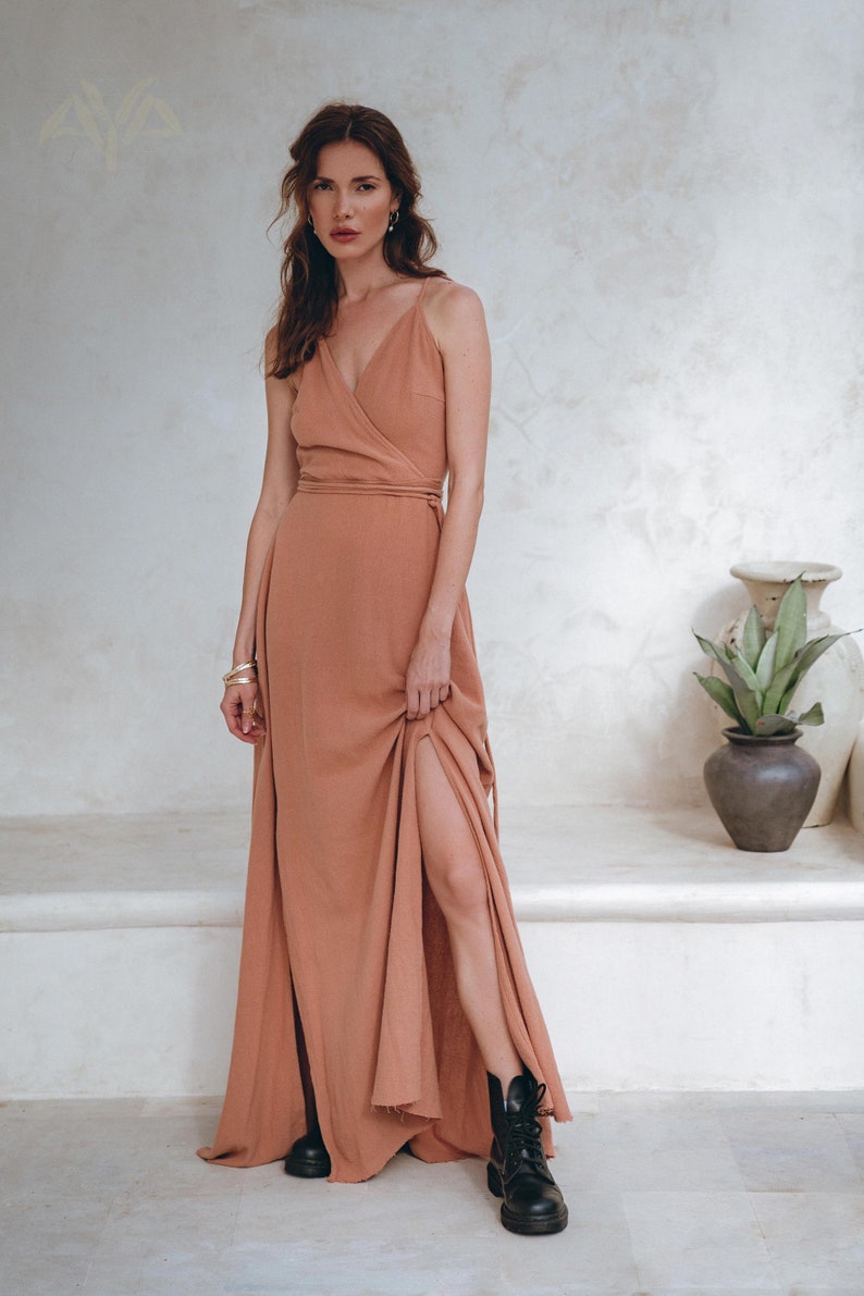 Are you looking for a gown with beautiful handmade details? Our open back summer dress with raw edge bottom in dusty pink is meant for you!